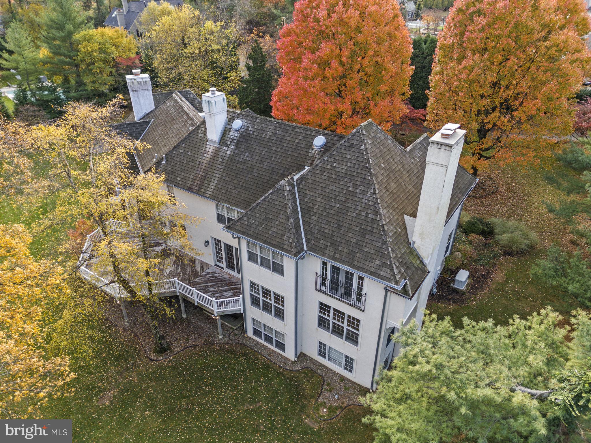 841 Mt Moro Road Villanova, PA 19085 - Photo 48 of 63 an aerial view of a house with swimming pool and wooden fence