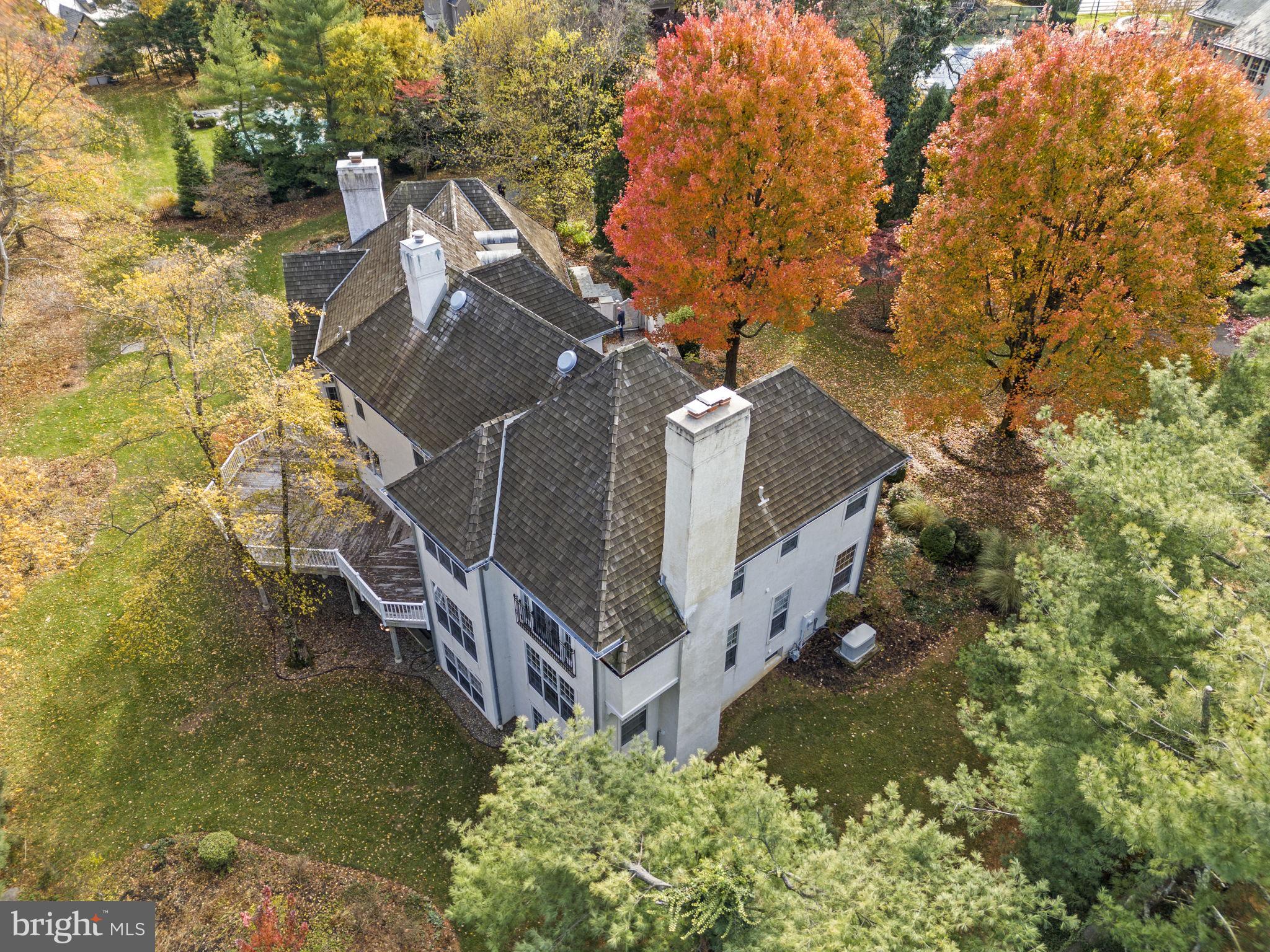 841 Mt Moro Road Villanova, PA 19085 - Photo 49 of 63 a view of a house with a small yard and large trees