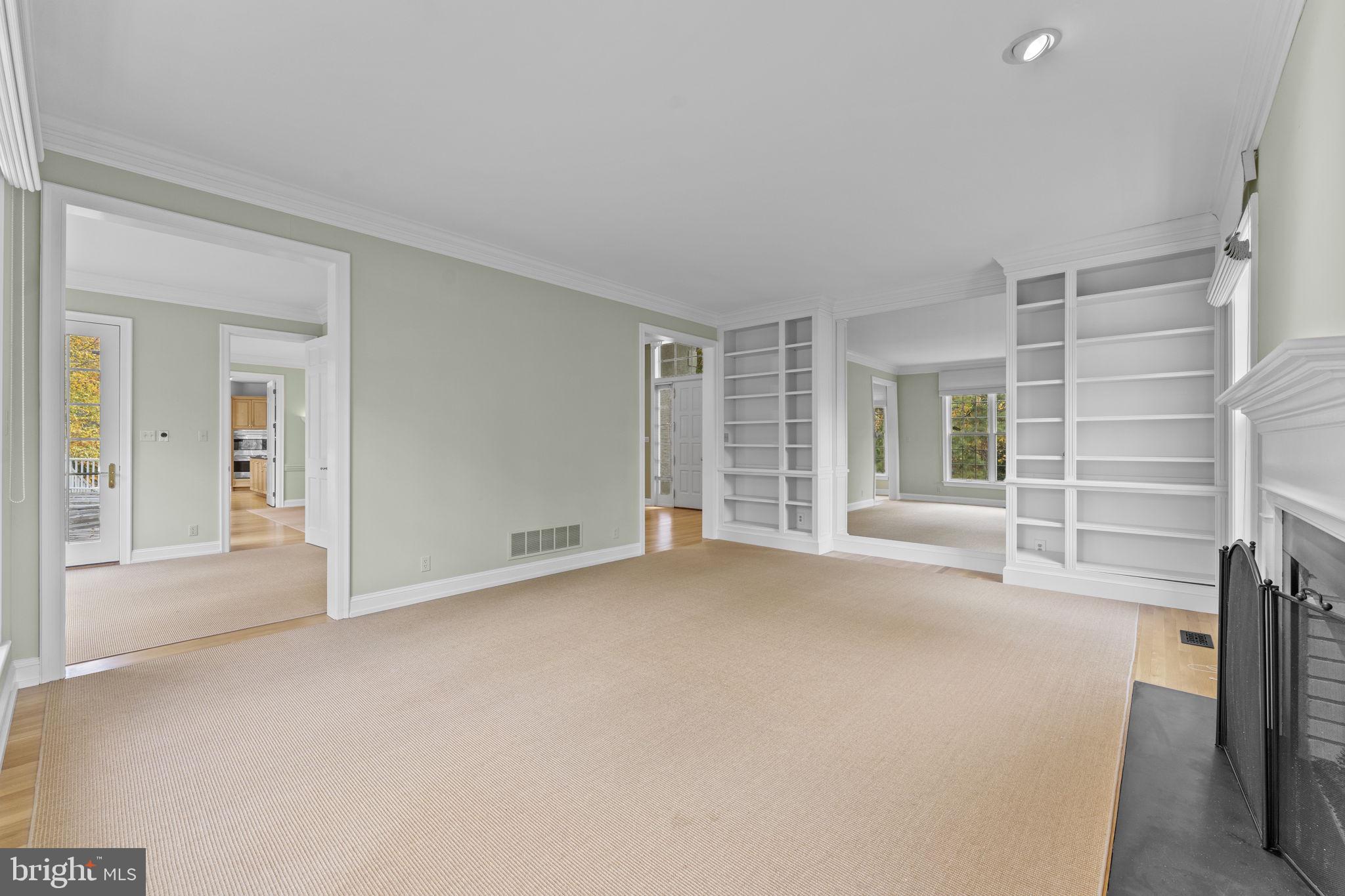 841 Mt Moro Road Villanova, PA 19085 - Photo 9 of 63 a view of an empty room with a fireplace and a window
