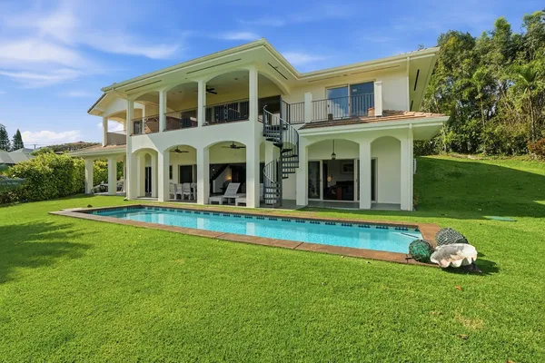 a front view of house with outdoor seating and yard