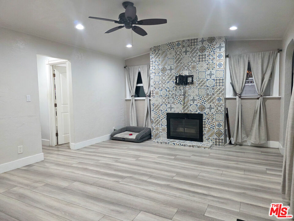 1111 North Spring Avenue Compton, CA 90221 - Photo 14 of 28 a view of an empty room with a fireplace
