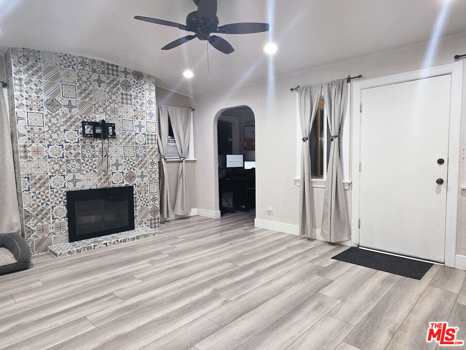 1111 North Spring Avenue Compton, CA 90221 - Photo 15 of 28 a view of a livingroom with a fireplace and window