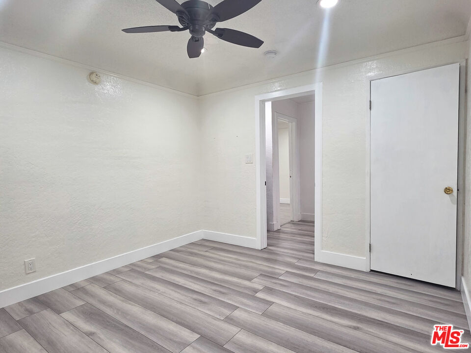 1111 North Spring Avenue Compton, CA 90221 - Photo 26 of 28 wooden floor in an empty room
