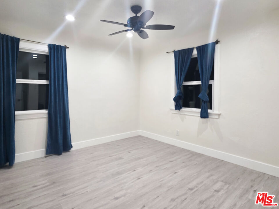 1111 North Spring Avenue Compton, CA 90221 - Photo 27 of 28 wooden floor in an empty room with a bathroom