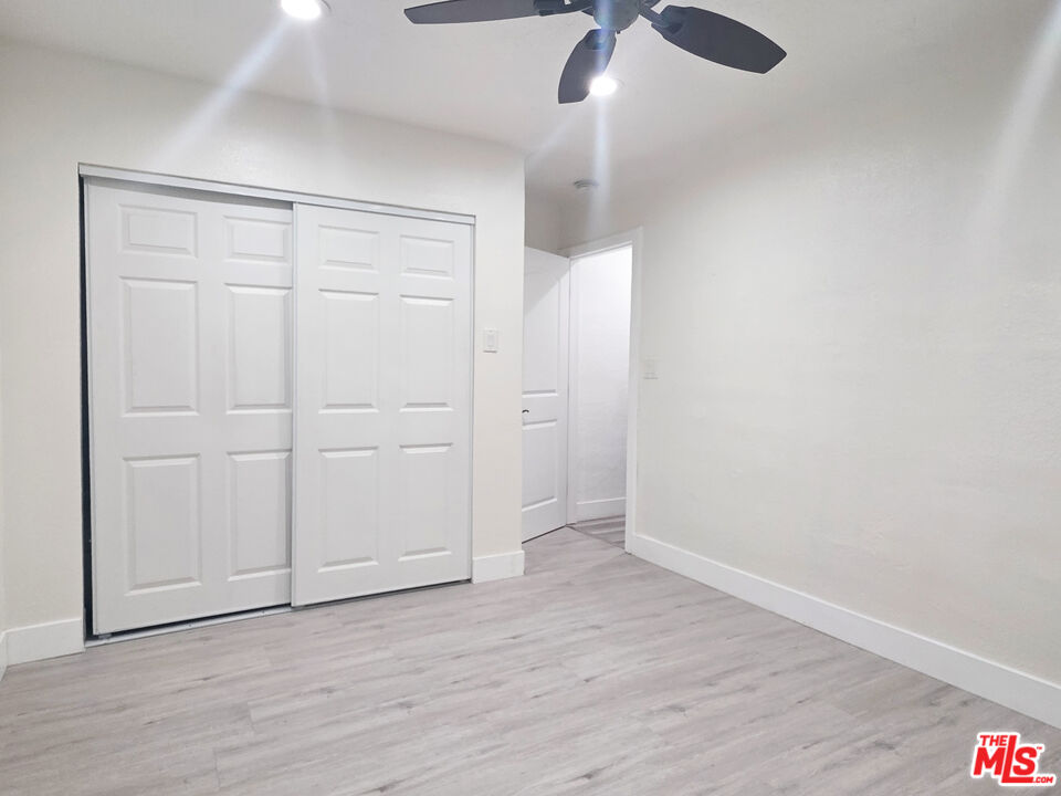 1111 North Spring Avenue Compton, CA 90221 - Photo 28 of 28 an empty room with wooden floor closet and windows