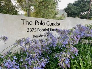 a sign broad in front of flowers