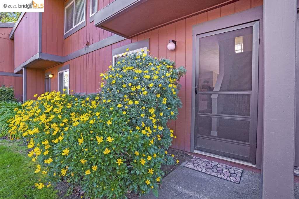 38627 Cherry Lane, Unit 2 Fremont, CA 94536 - Photo 1 of 1 a couple of potted plants in front of door