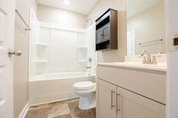 a bathroom with a sink a toilet and a bathtub