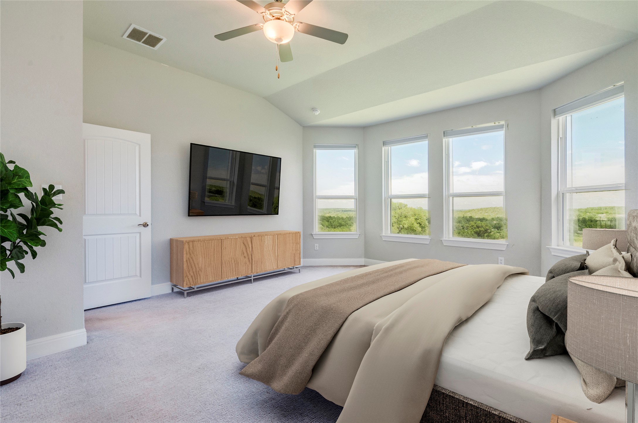 130 Sierra Blanca Road Dripping Springs, TX 78620 - Photo 13 of 24 a spacious bedroom with a bed and a flat screen tv