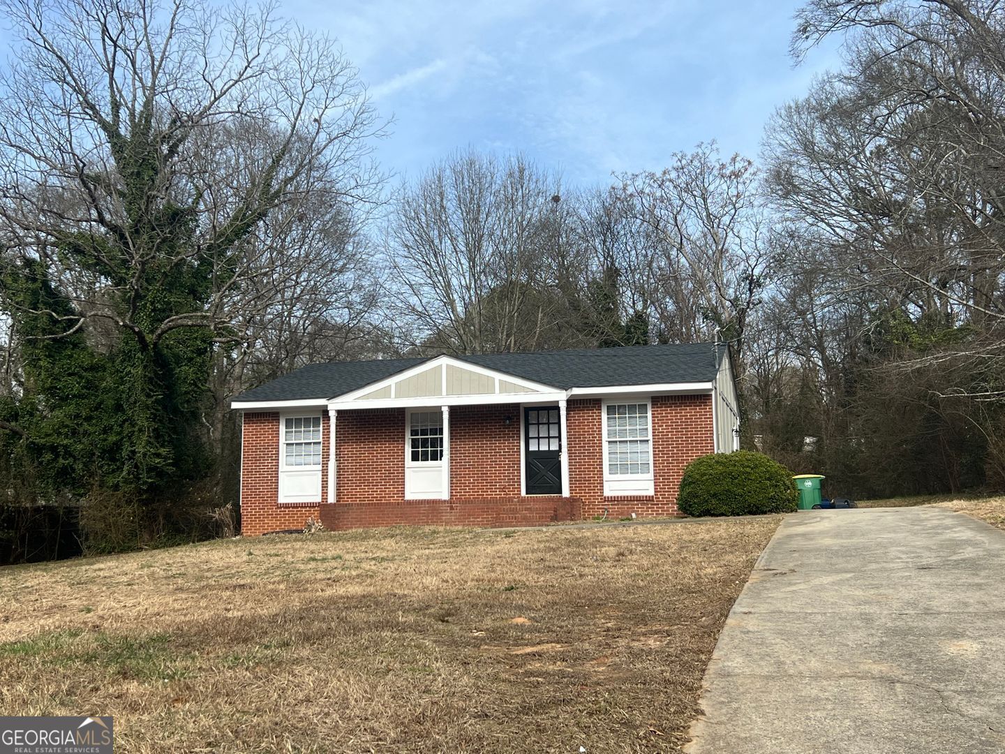 1695 East Broad Street, Unit A Athens, GA 30601 - Photo 3 of 13 a front view of a house with yard and trees