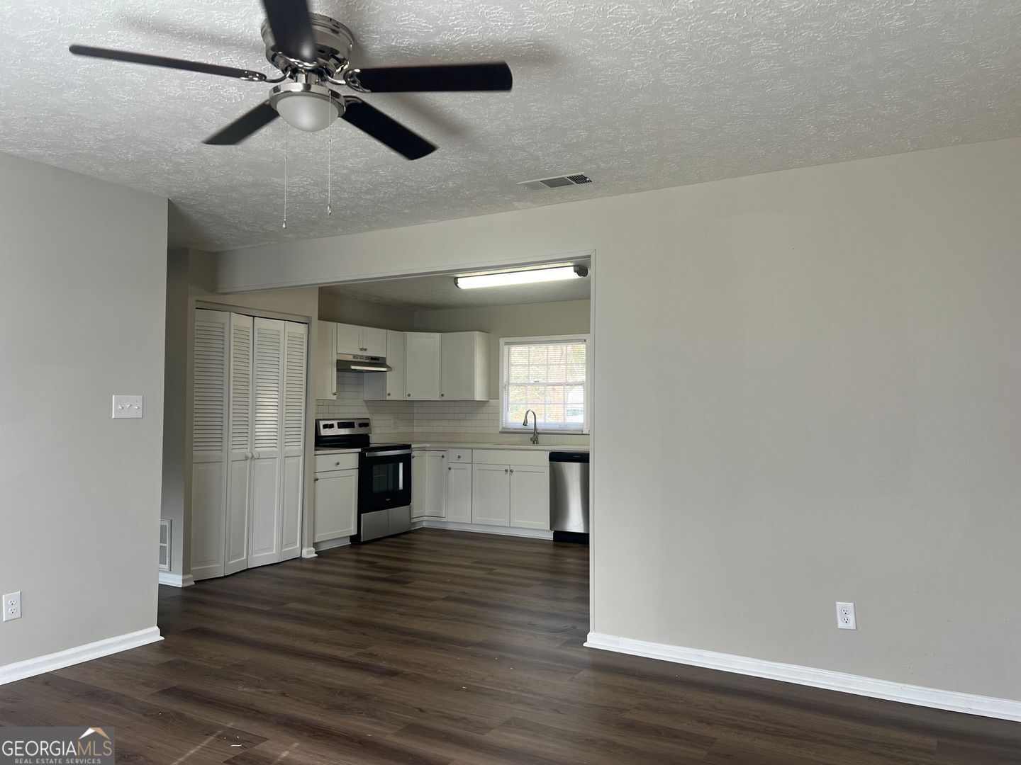 1695 East Broad Street, Unit A Athens, GA 30601 - Photo 7 of 13 a kitchen with a refrigerator and a stove top oven