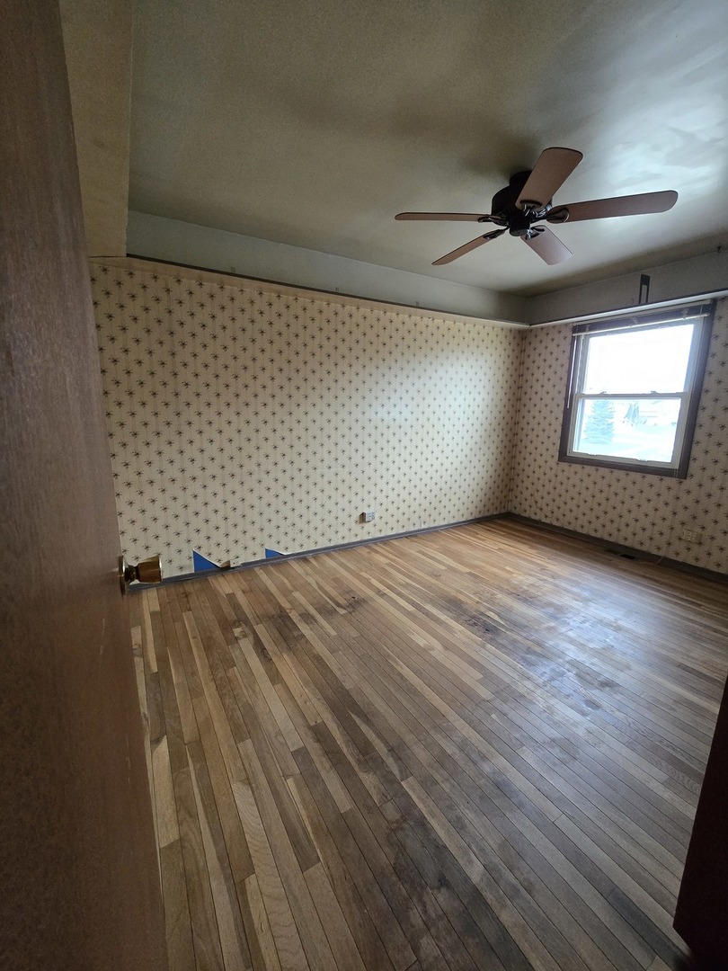 2075 Greenfield Road Hoffman Estates, IL 60169 - Photo 13 of 23 wooden floor in an empty room