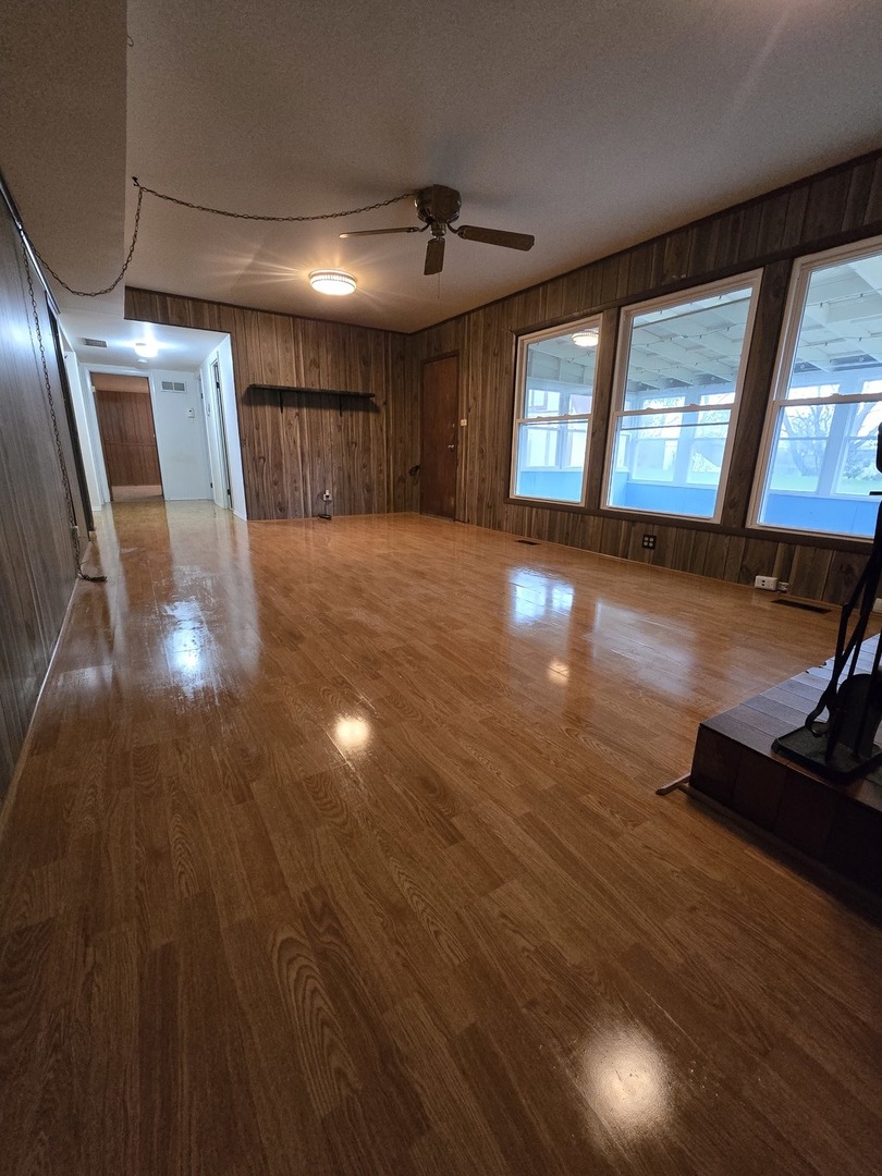2075 Greenfield Road Hoffman Estates, IL 60169 - Photo 20 of 23 a view of an empty room with wooden floor and a window