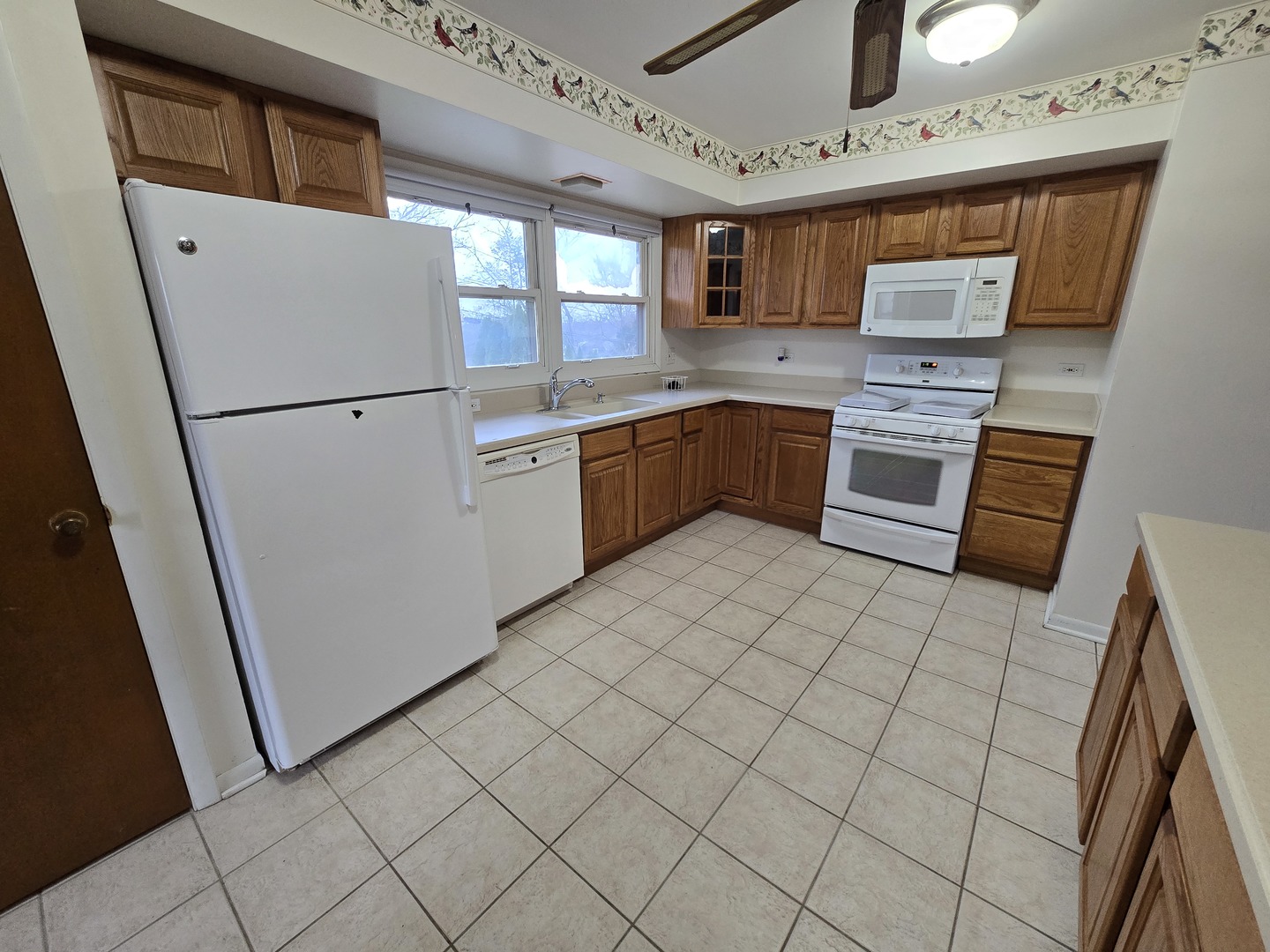 2075 Greenfield Road Hoffman Estates, IL 60169 - Photo 6 of 23 a kitchen with stainless steel appliances a refrigerator sink and microwave