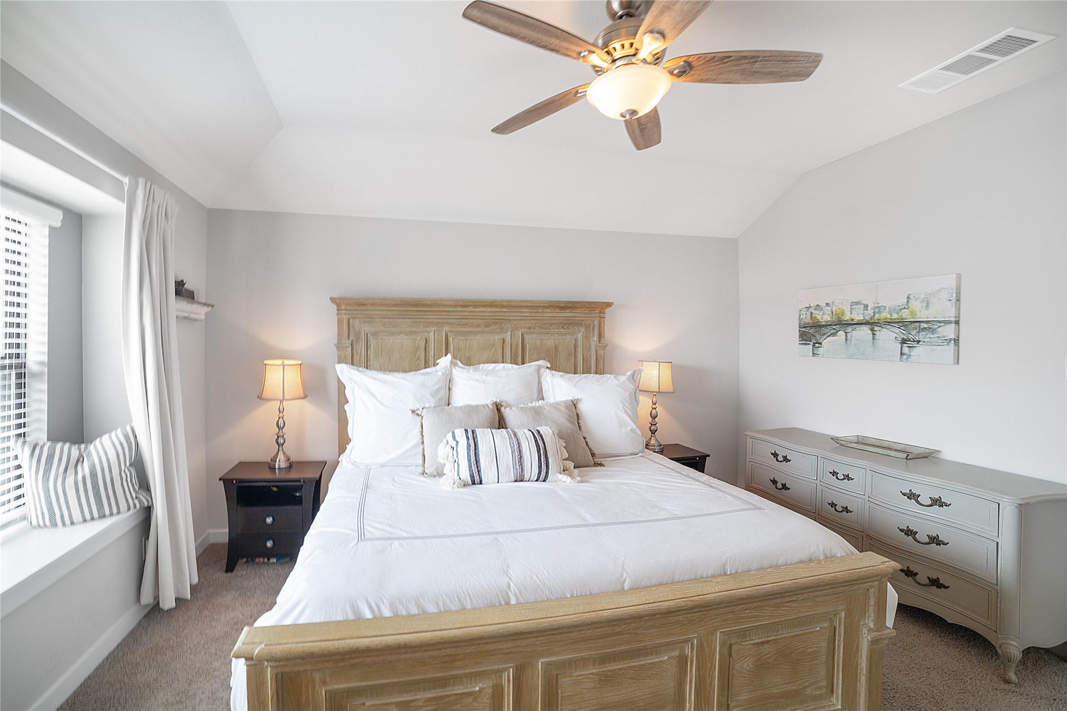 180 Waterside Road, Unit B Buda, TX 78610 - Photo 10 of 27 a bedroom with a large bed and a chandelier