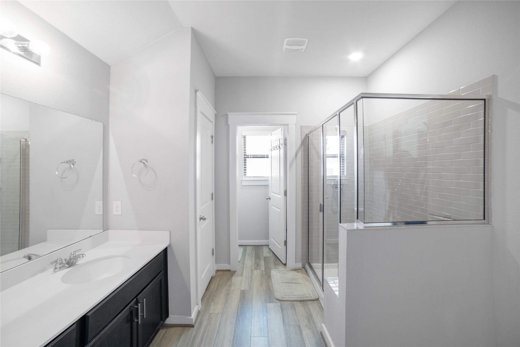 180 Waterside Road, Unit B Buda, TX 78610 - Photo 12 of 27 a bathroom with a sink and a mirror