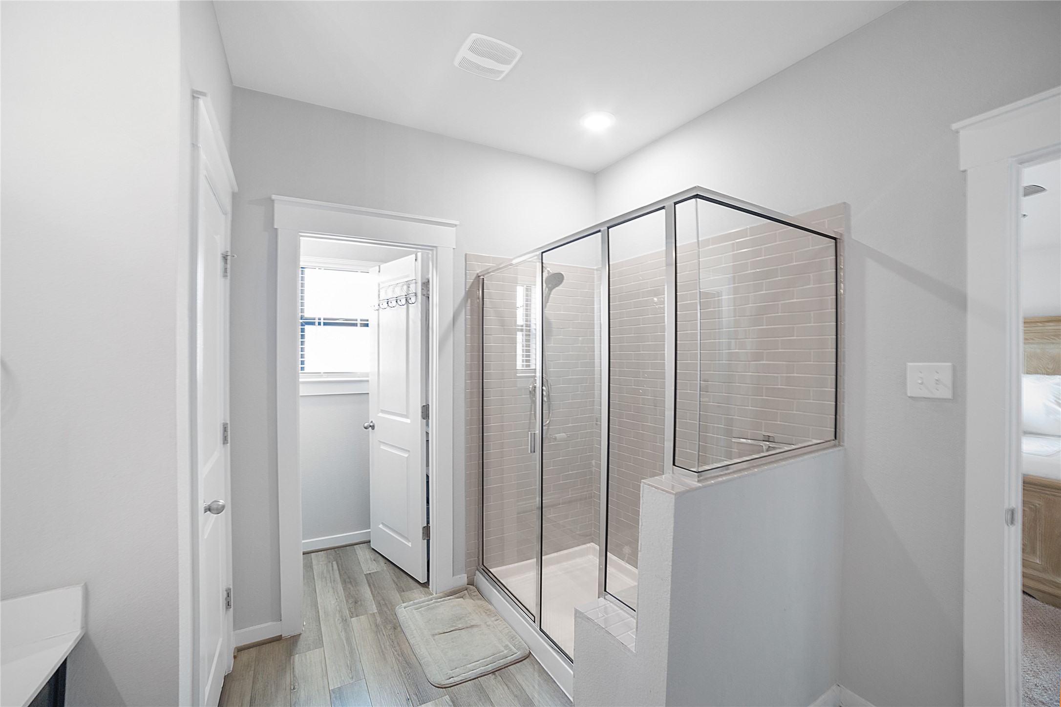 180 Waterside Road, Unit B Buda, TX 78610 - Photo 13 of 27 a bathroom with a shower and a glass door