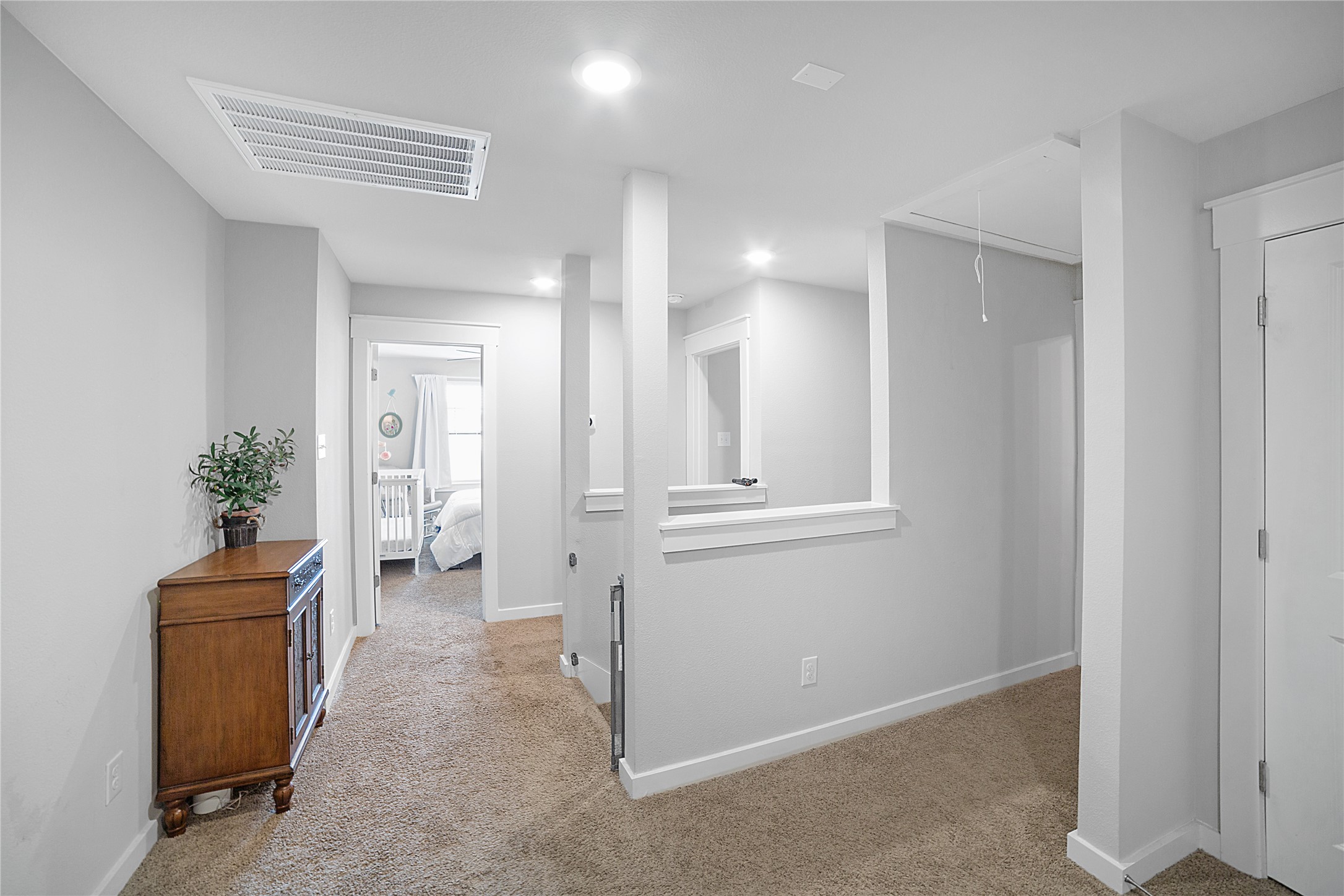 180 Waterside Road, Unit B Buda, TX 78610 - Photo 15 of 27 a view of a hallway with closet and a living room