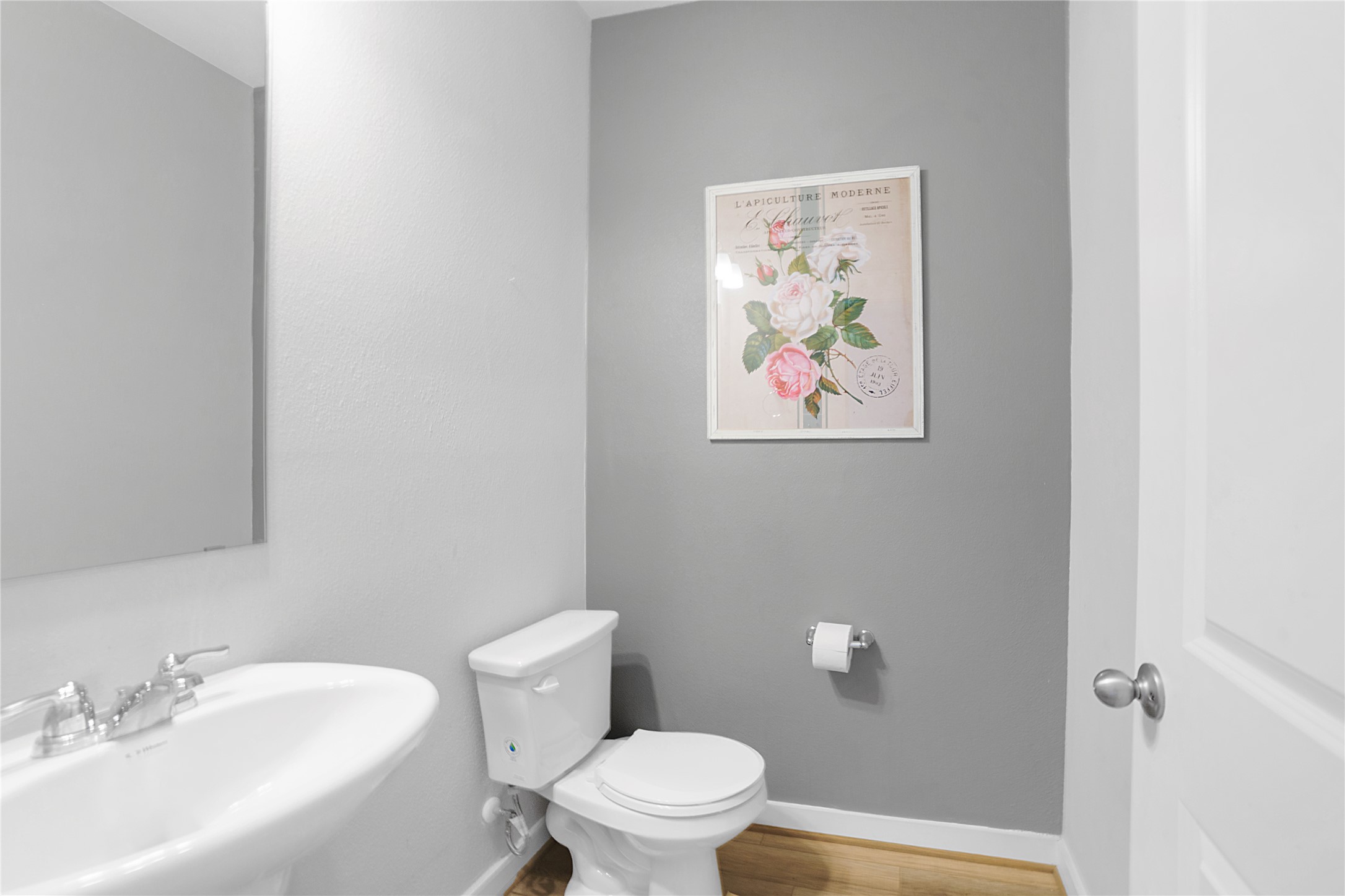 180 Waterside Road, Unit B Buda, TX 78610 - Photo 16 of 27 a white toilet sitting next to a bathroom sink