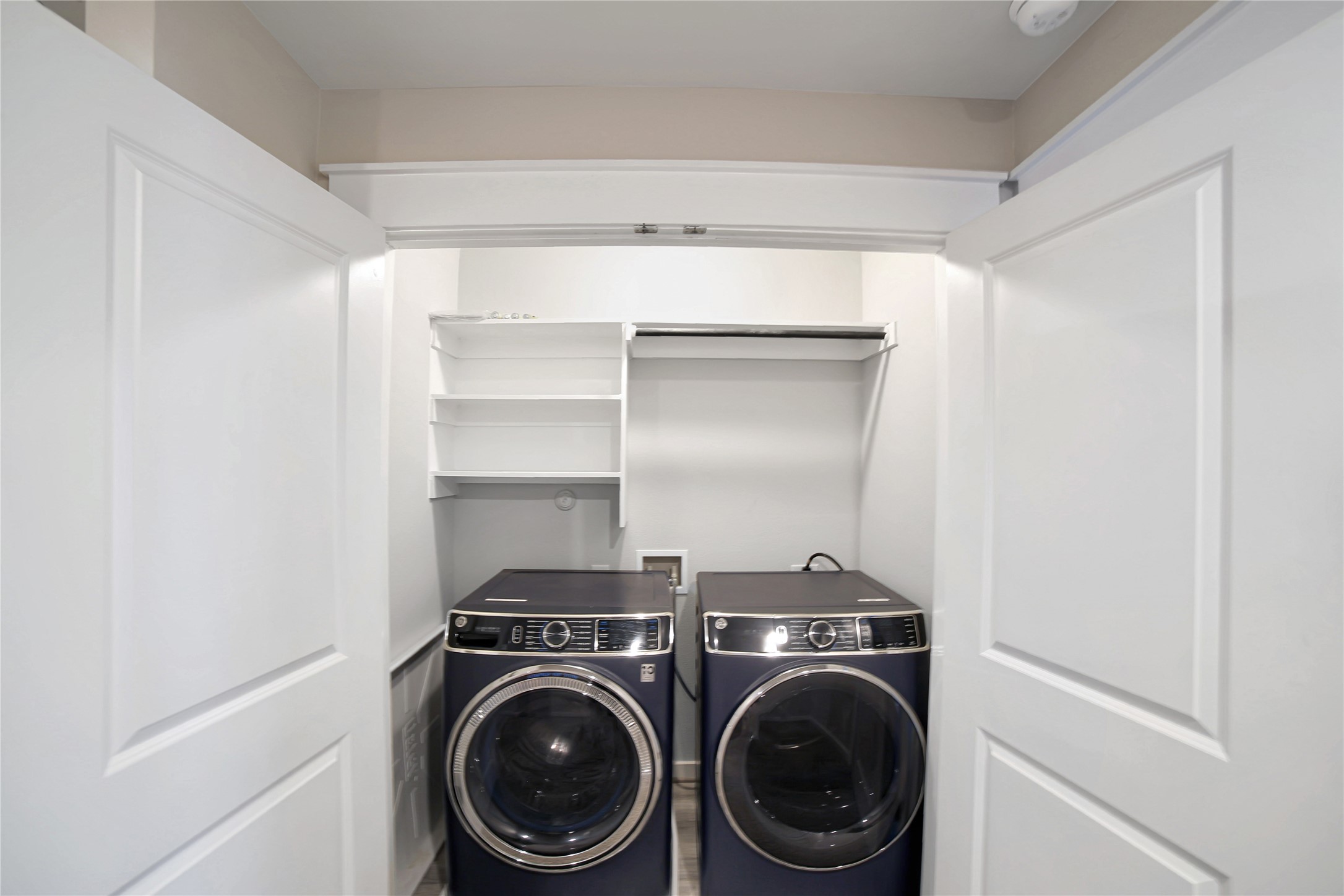 180 Waterside Road, Unit B Buda, TX 78610 - Photo 17 of 27 a utility room with sink dryer and washer