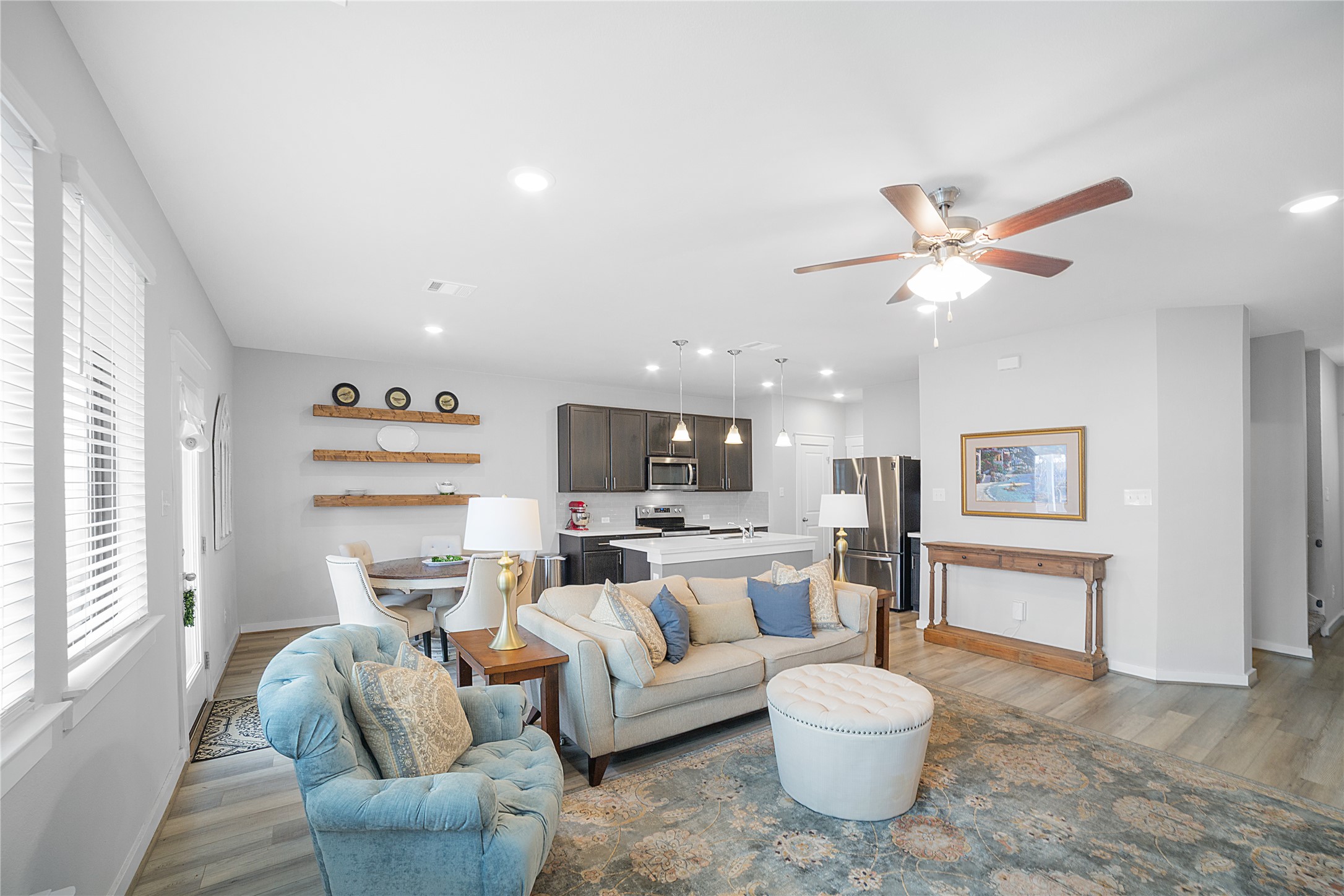 180 Waterside Road, Unit B Buda, TX 78610 - Photo 2 of 27 a living room with furniture a flat screen tv and a window
