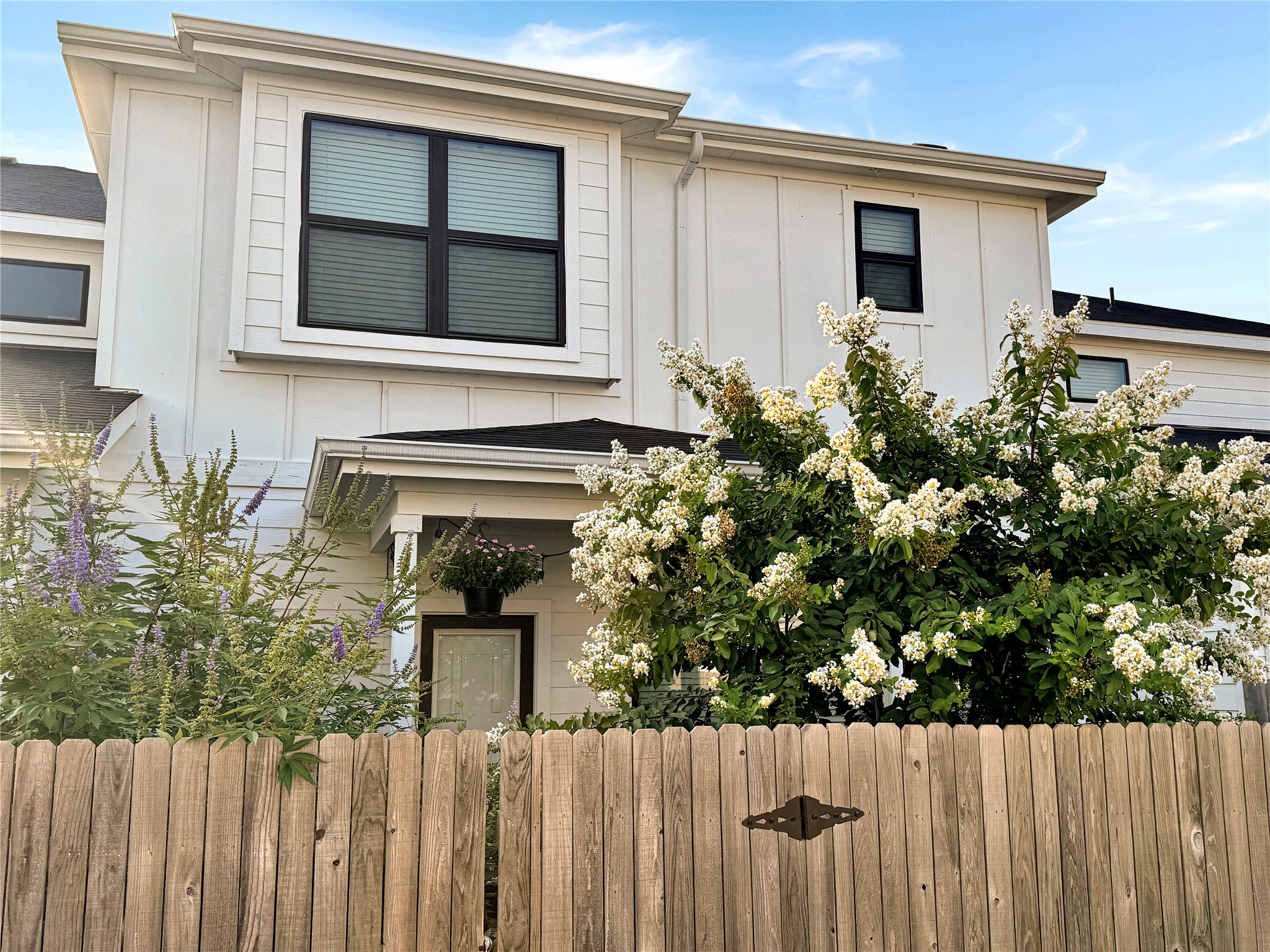 180 Waterside Road, Unit B Buda, TX 78610 - Photo 21 of 27 a house view with a garden space