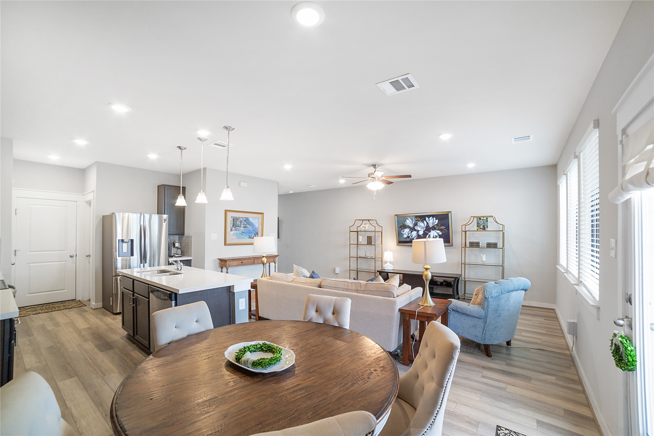 180 Waterside Road, Unit B Buda, TX 78610 - Photo 3 of 27 a living room with stainless steel appliances furniture a dining table and kitchen view