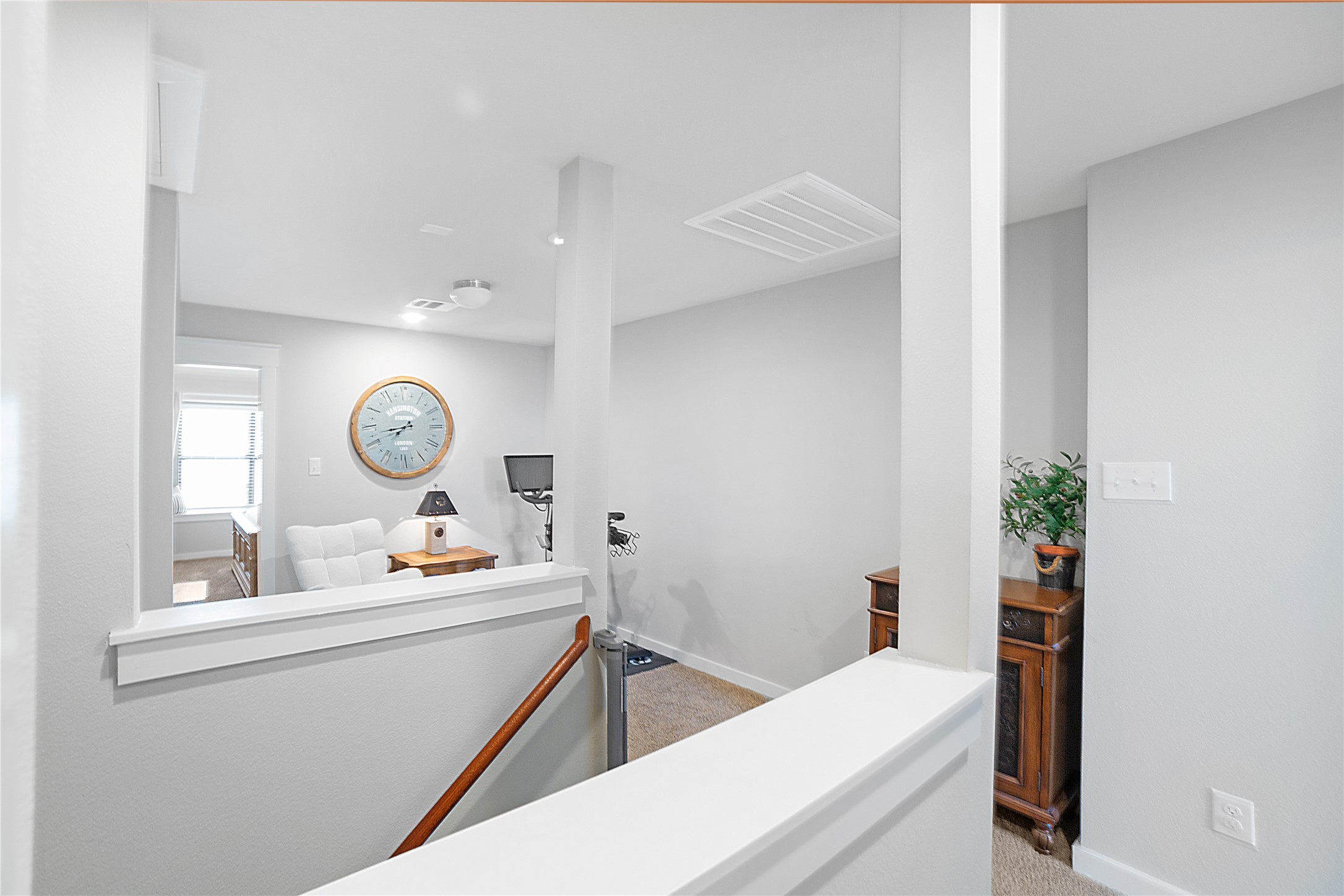 180 Waterside Road, Unit B Buda, TX 78610 - Photo 5 of 27 a room with a window and flowerpot