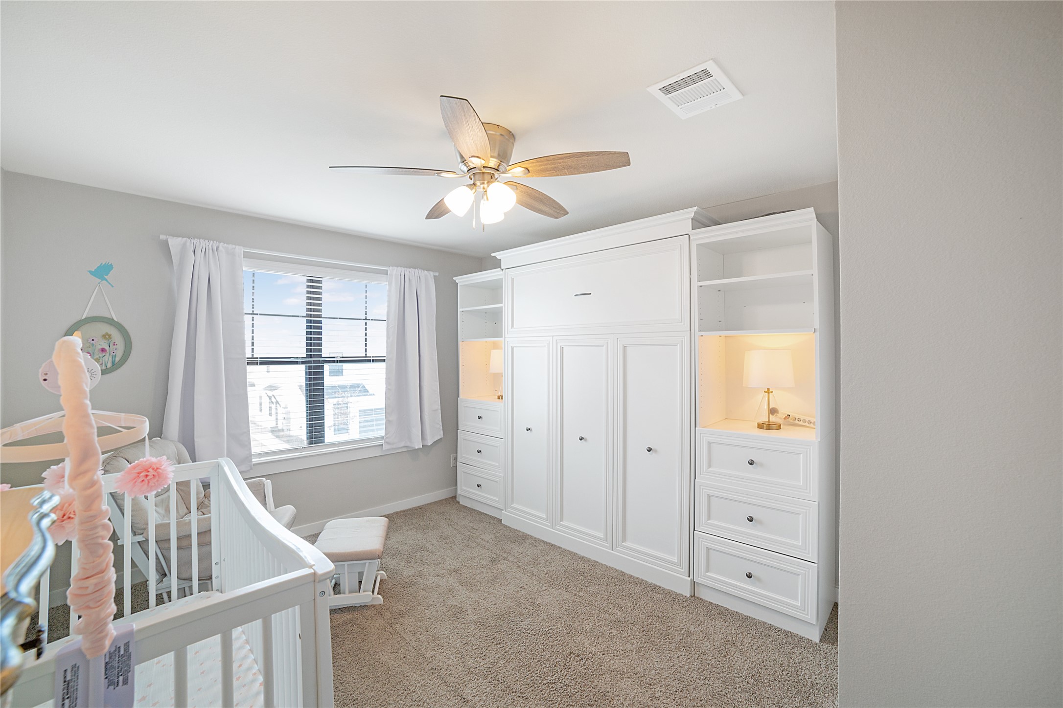 180 Waterside Road, Unit B Buda, TX 78610 - Photo 6 of 27 a view of a livingroom with a window and a ceiling fan