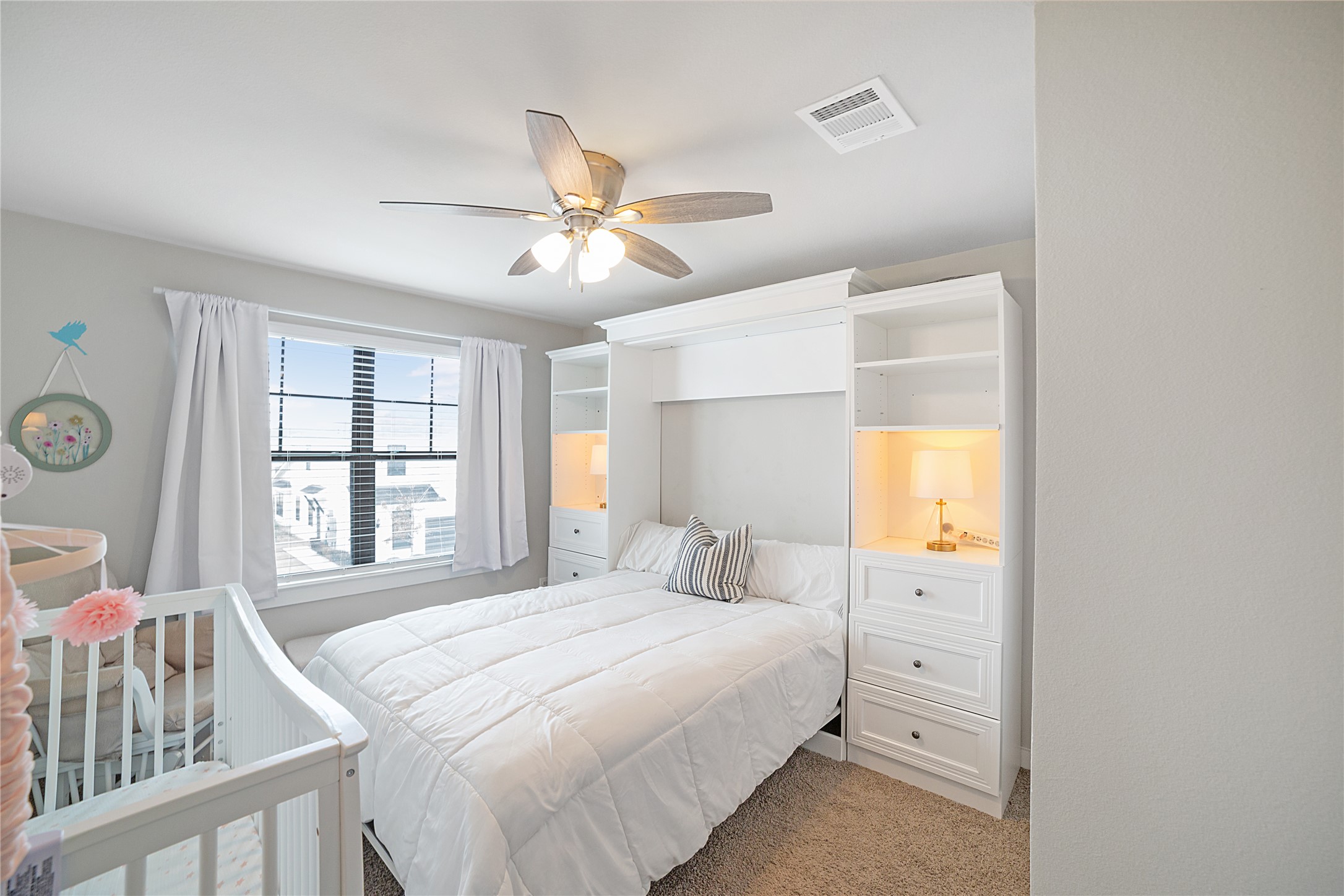 180 Waterside Road, Unit B Buda, TX 78610 - Photo 7 of 27 a bedroom with a bed and a window