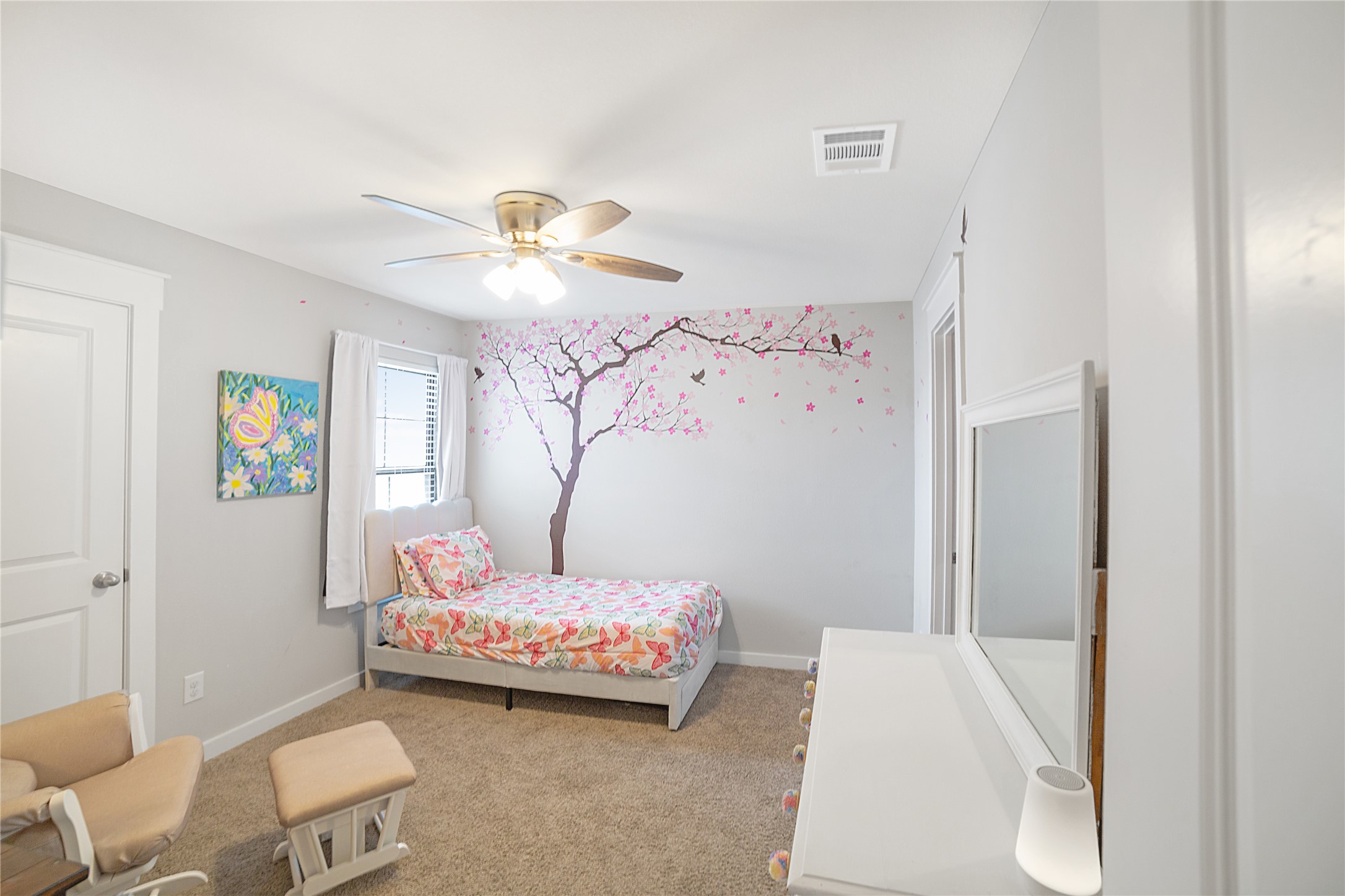 180 Waterside Road, Unit B Buda, TX 78610 - Photo 8 of 27 a bedroom with a bed and a chandelier