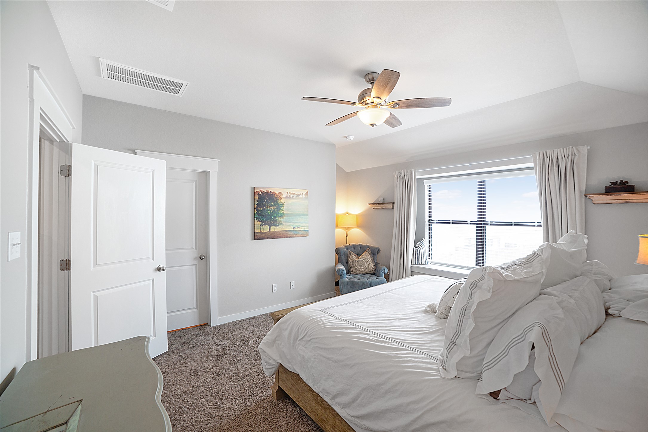 180 Waterside Road, Unit B Buda, TX 78610 - Photo 9 of 27 a bedroom with a large bed and a window