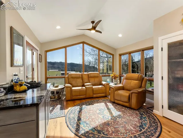 a living room with furniture and a large window