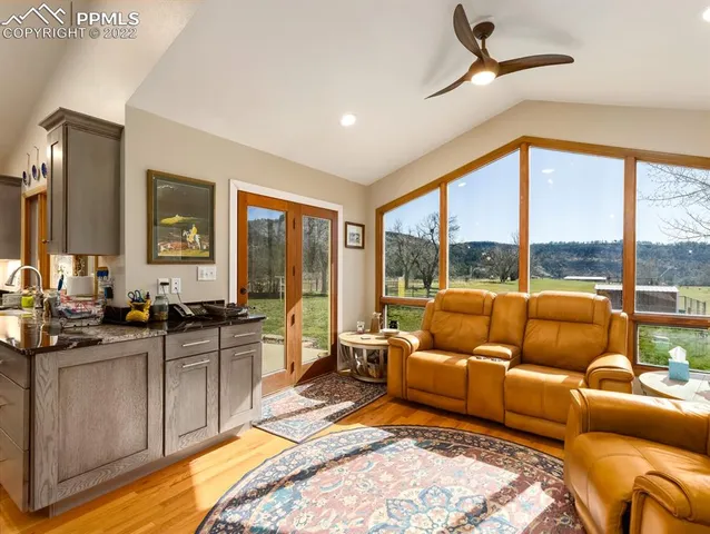 a living room with furniture and a large window