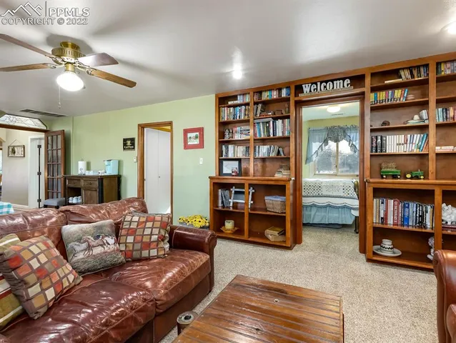 a bedroom with furniture and a window