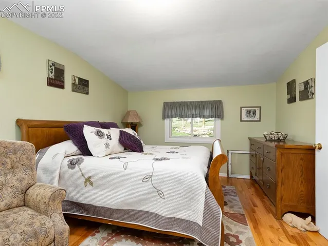 a bedroom with a bed and a closet