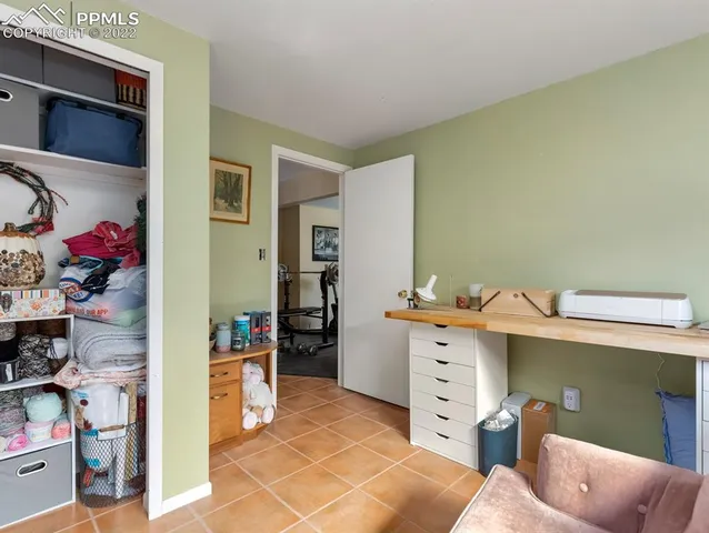 a view of a workspace with furniture and a livingroom