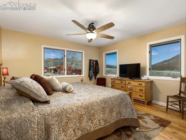 a bedroom with a large bed and a window