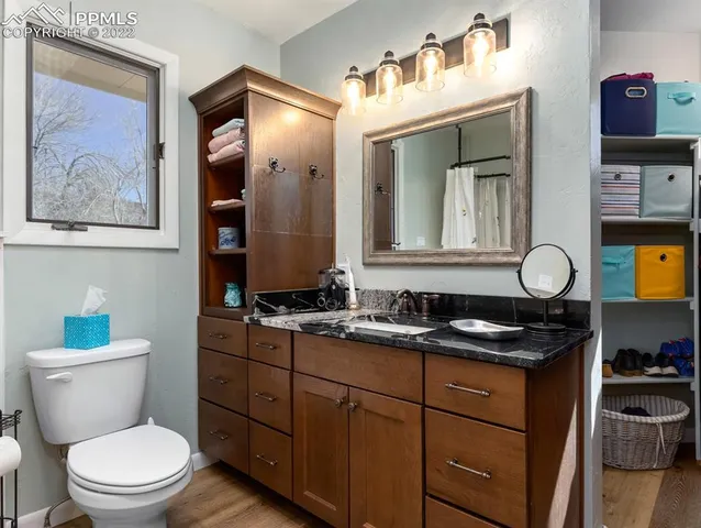 a white toilet sitting next to a bathtub