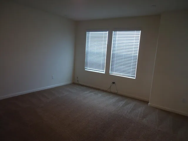 a empty walk in closet room with a shower