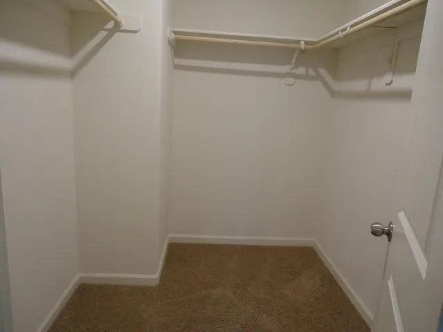a view of a porch with a floor to ceiling window and a yard