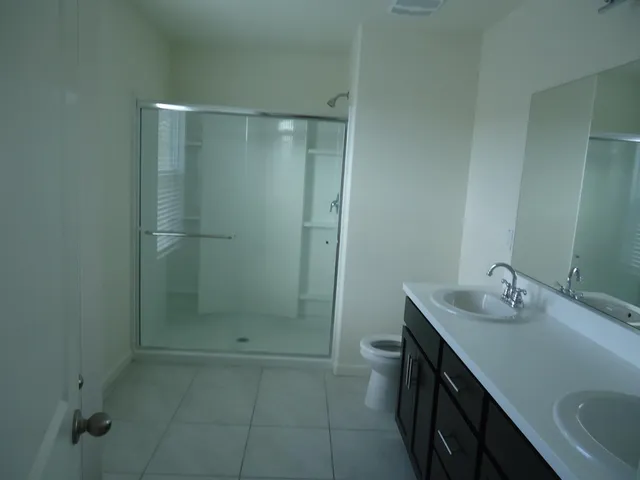 a view of backyard with swimming pool