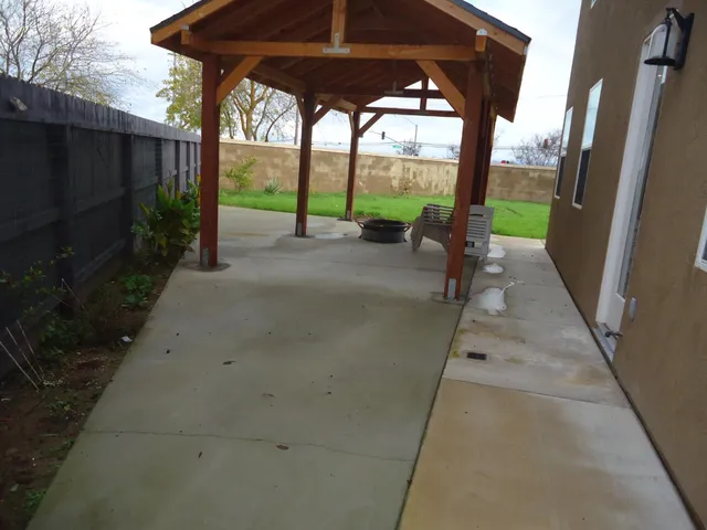 a view of a garden with a building in the background
