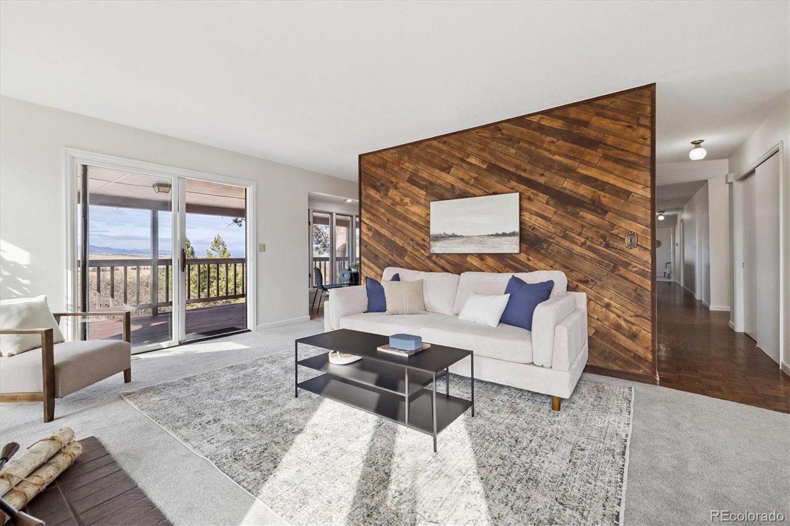 1482 North Perry Park Road Sedalia, CO 80135 - Photo 28 of 50 a living room with furniture and a flat screen tv