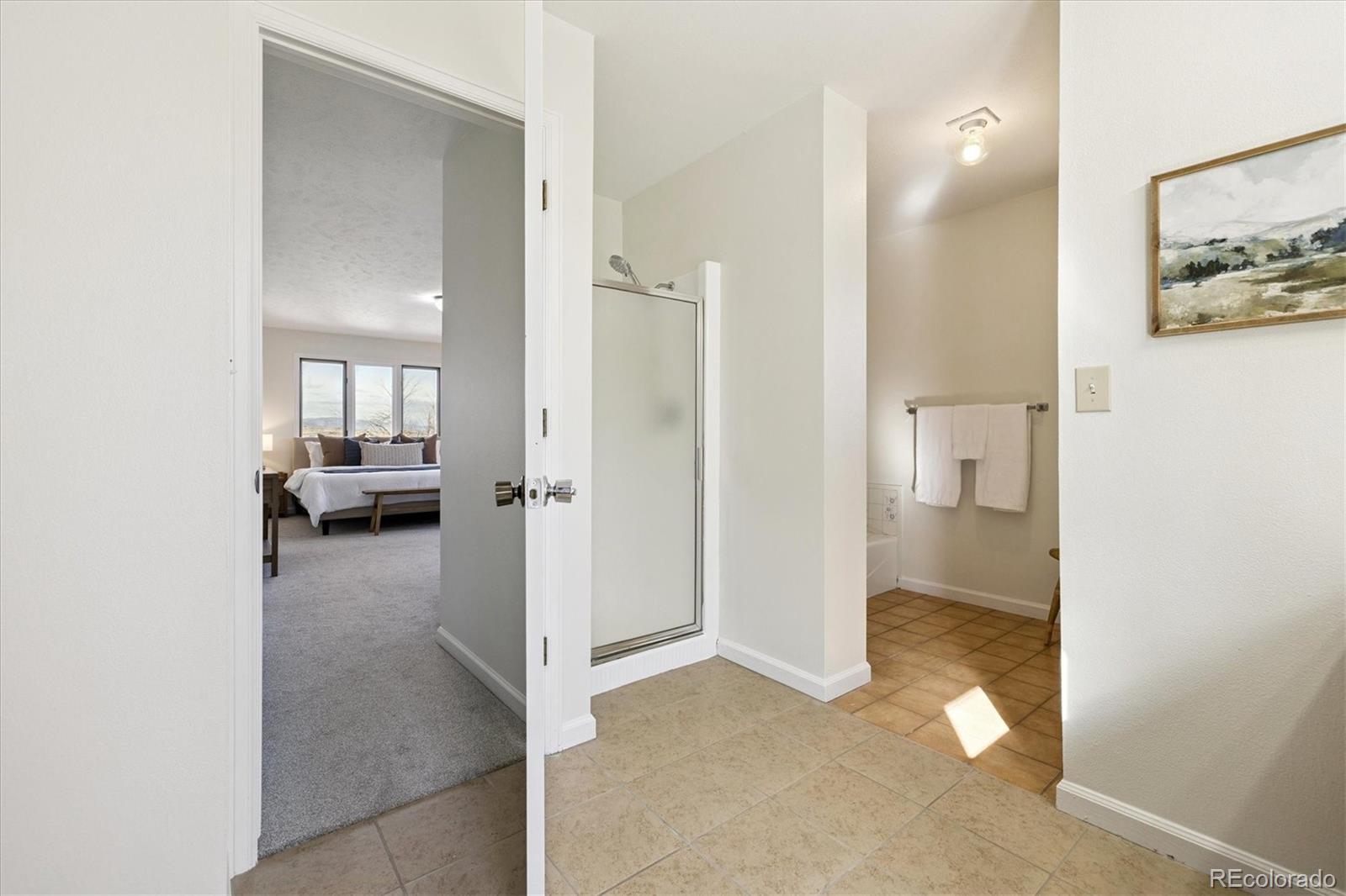 1482 North Perry Park Road Sedalia, CO 80135 - Photo 32 of 50 a view of a livingroom and a hall with an entryway