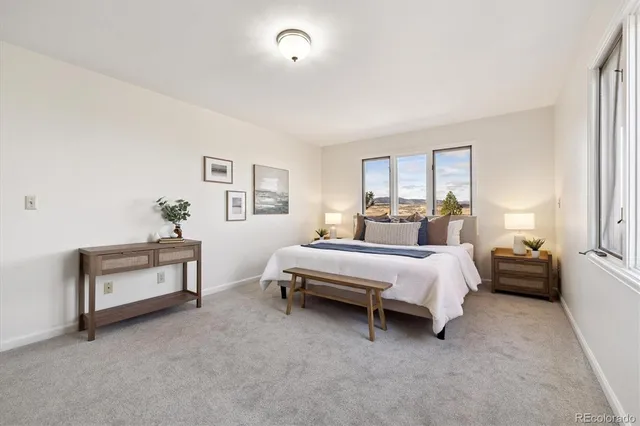 a view of a livingroom with furniture and a window