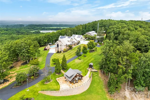 a view of a garden with a building in the background