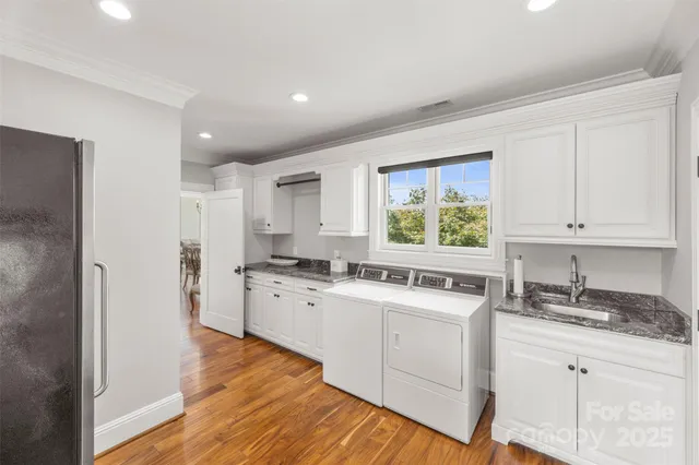 a kitchen with a stove a sink and a refrigerator