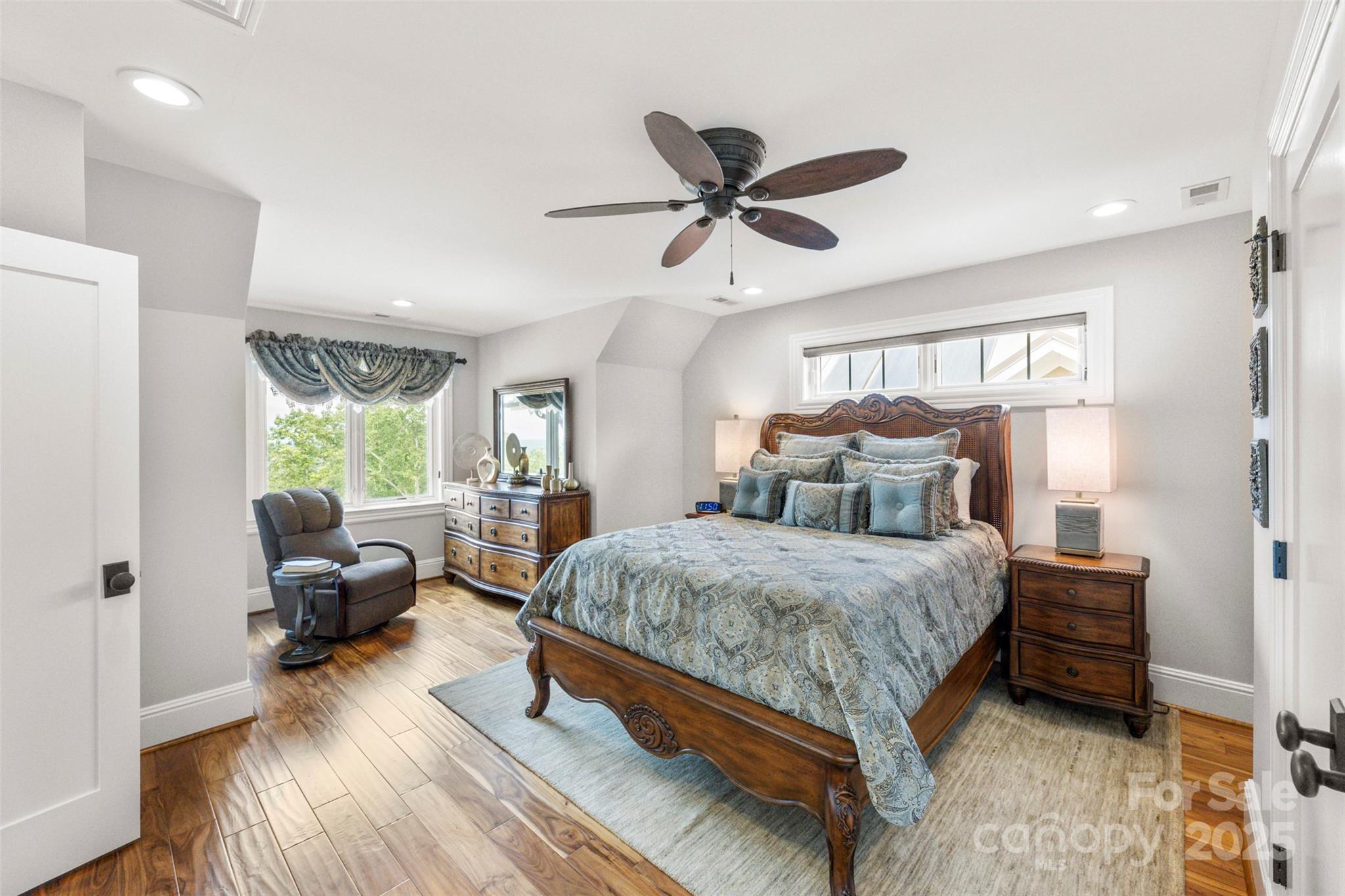 605 Recore Rdg Road Bessemer City, NC 28016 - Photo 25 of 48 a spacious bedroom with a bed and wooden floor