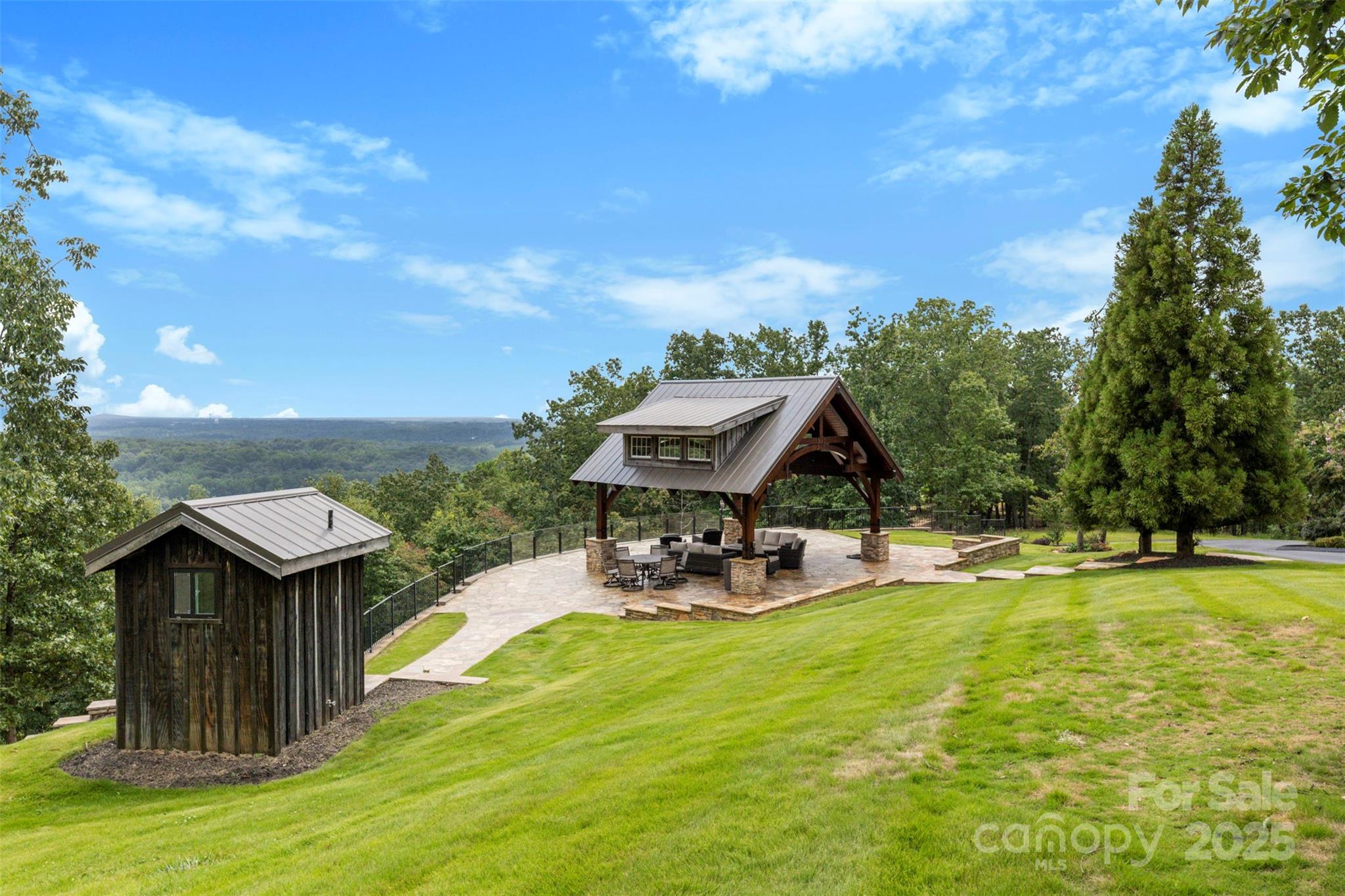 605 Recore Rdg Road Bessemer City, NC 28016 - Photo 40 of 48 a view of a swimming pool with lawn chairs under an umbrella